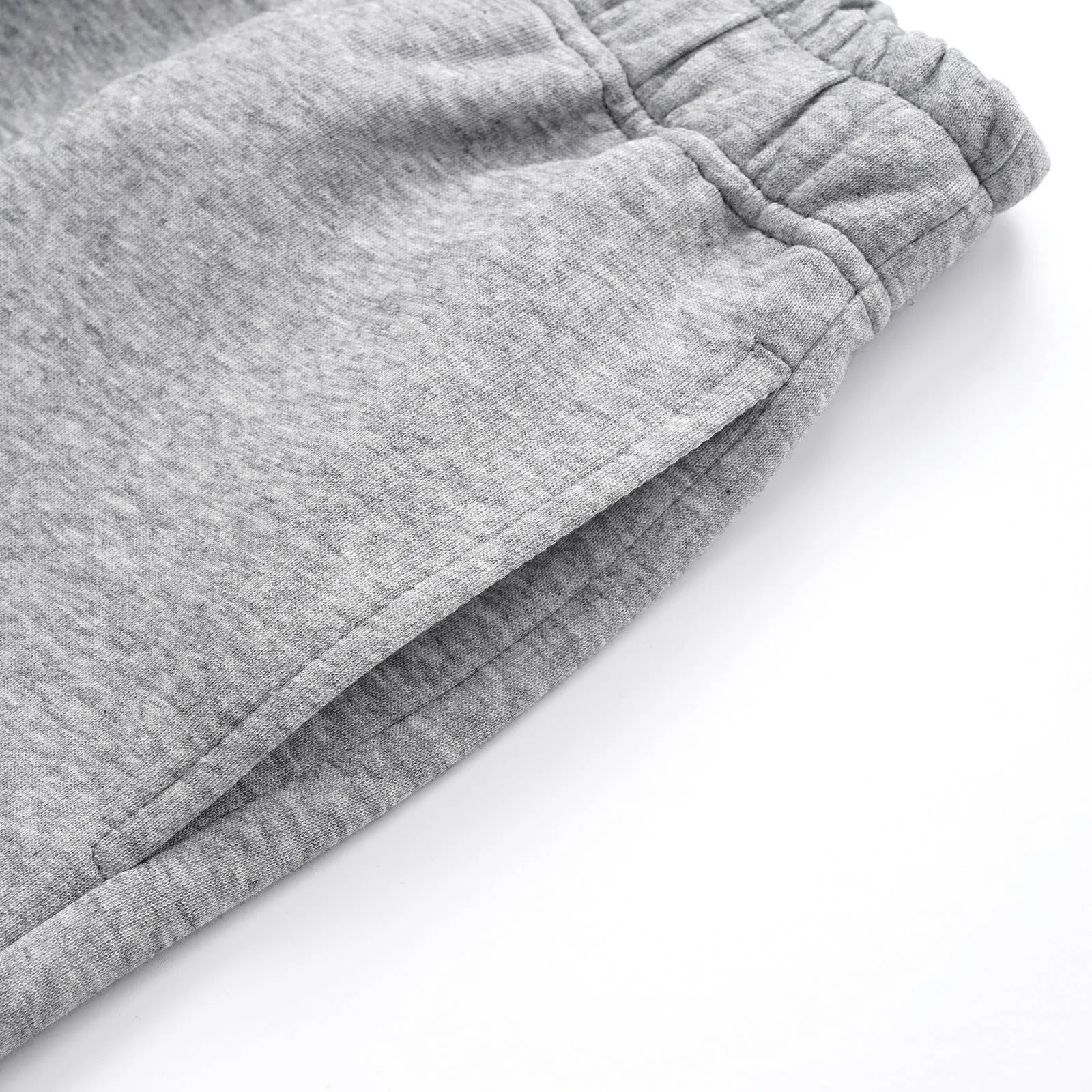 Men's grey cotton straight-leg loose fit trousers with an elasticated waistband on a neutral background.