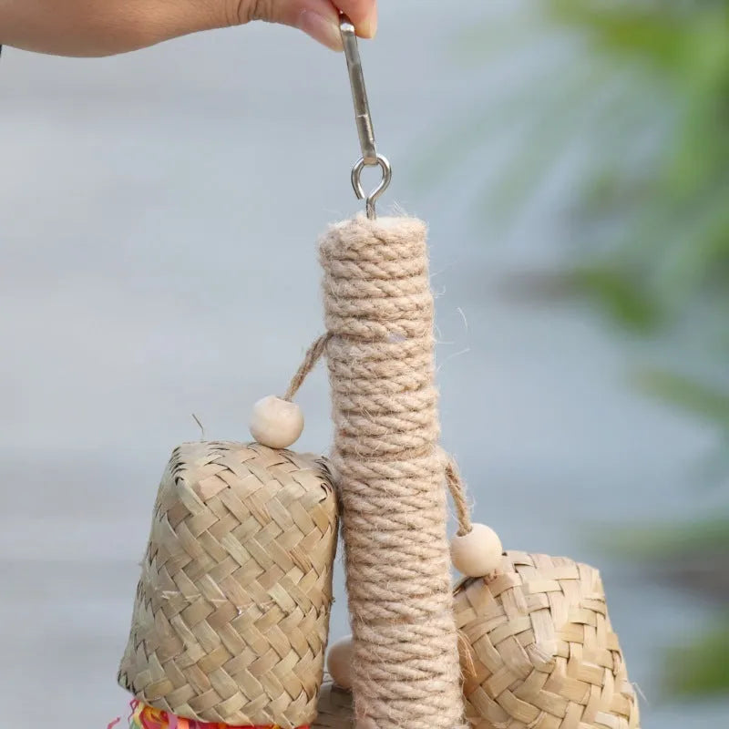 Wood and sisal parrot toy with colourful shredded paper measuring 15cm by 35cm