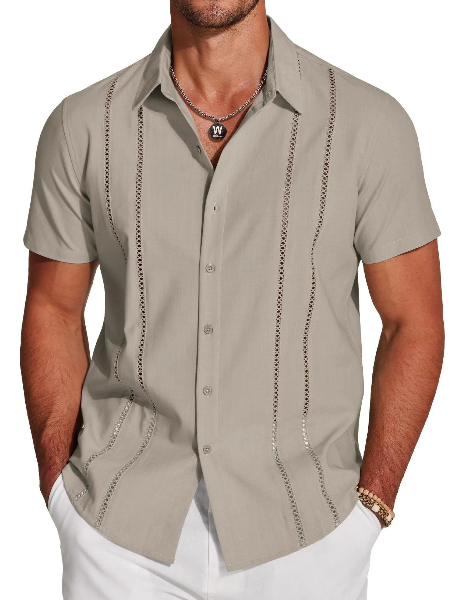 Man wearing a slim fit digital print Hawaiian short sleeve shirt in a casual setting