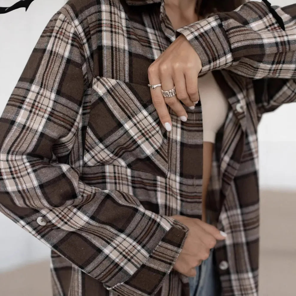 Dark brown retro striped women's shirt with collage stitching detail on the front, long sleeves.