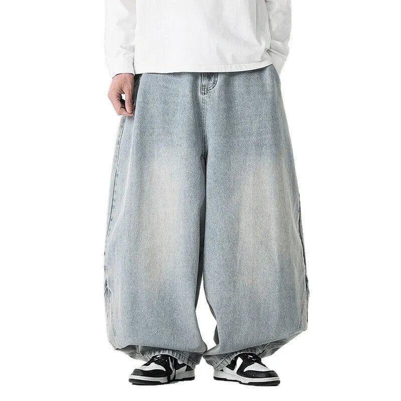 Men's plus size light blue wide leg baggy denim jeans with a low waist and straight leg opening.