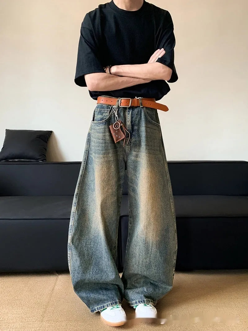 Men's retro blue distressed jeans with machete wash pattern and wide-leg design