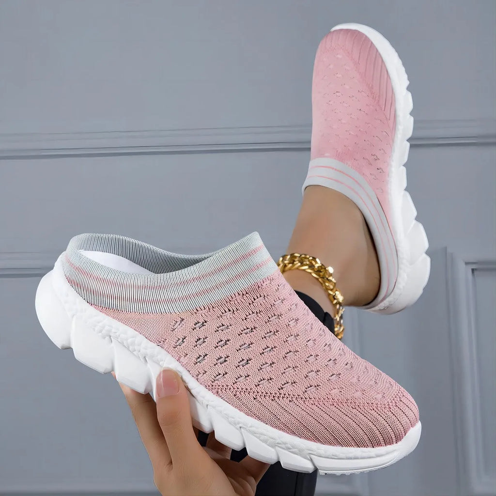 Women's black Flyknit socks semi slipper shoes with striped pattern and hollow-out design on a viscose sole.