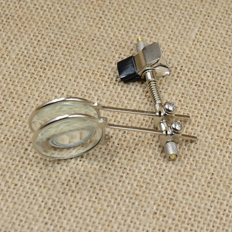Reading glasses mirror clip attachment with double metal clips and glass auxiliary lenses.