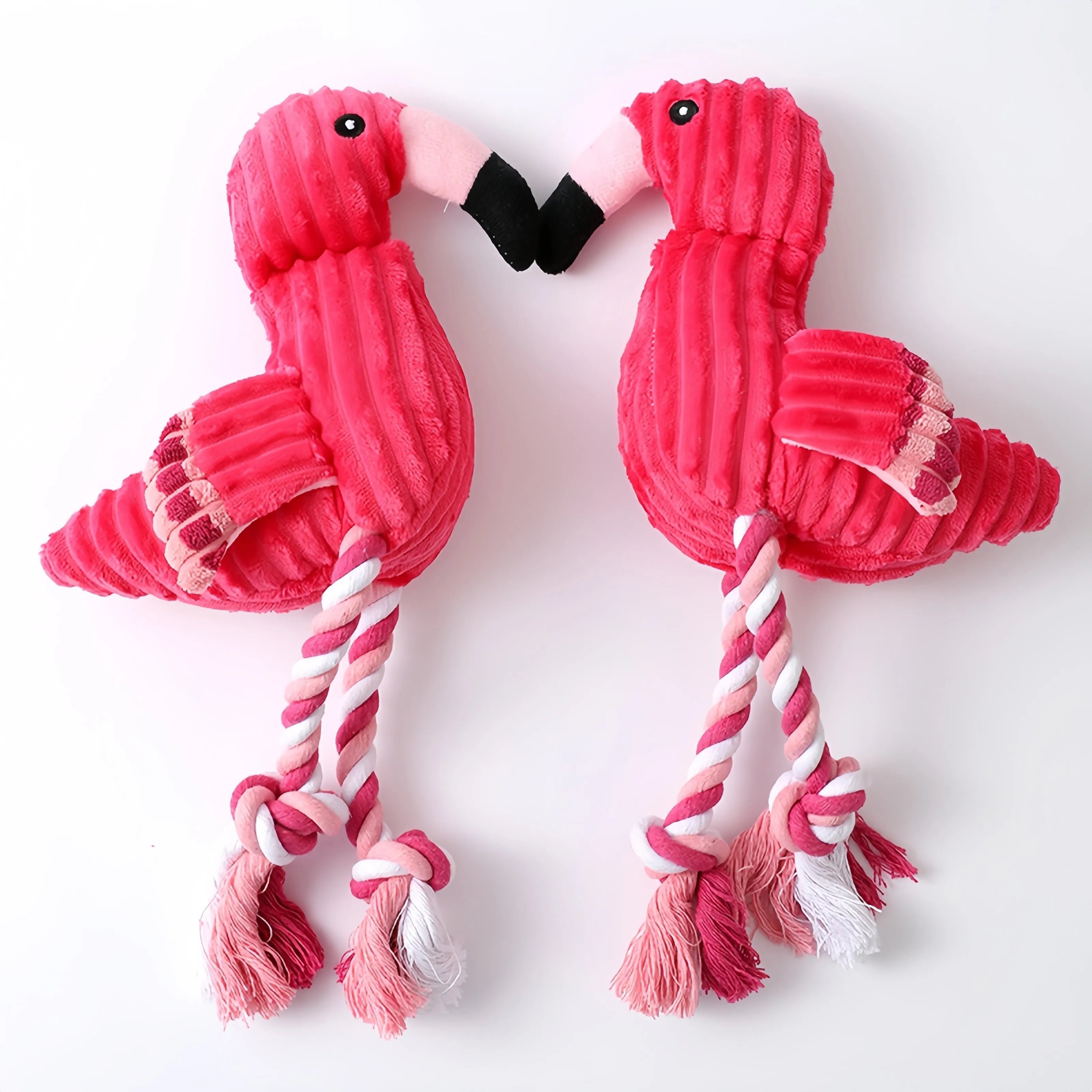 Pink rabbit-shaped corduroy plush dog toy with squeaker inside