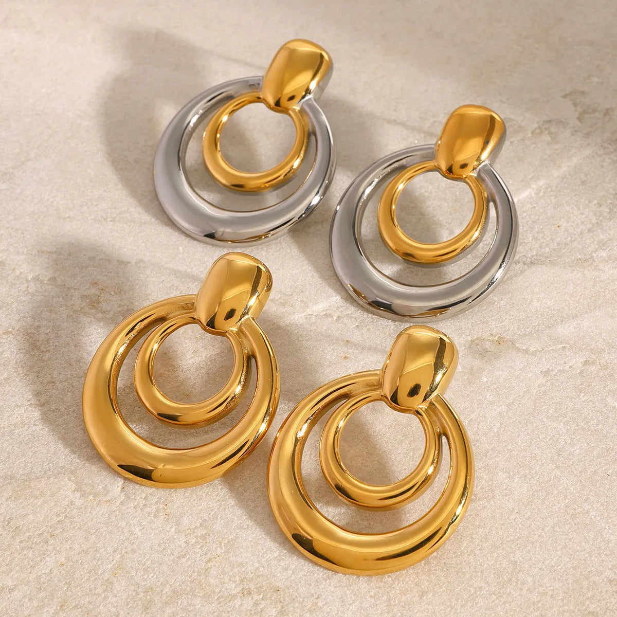 Golden round double layer hollow stud earrings with geometric design