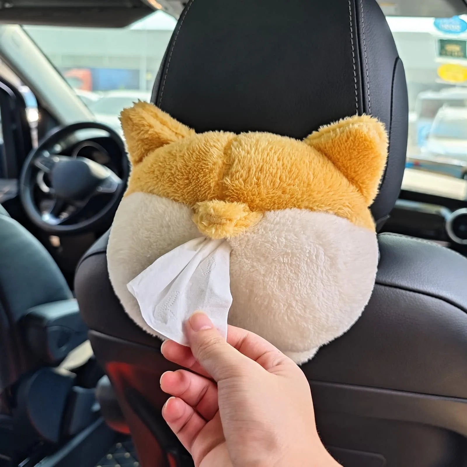 Yellow soft plush Corgi butt shaped tissue box cover with elastic strap for car visor.