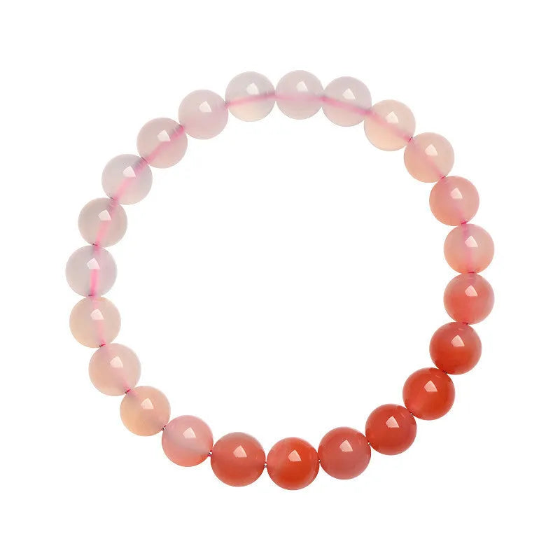 Natural gradient Yanyuan agate bracelet with geometry-cut beads on a wrist, showing salt source colour variation.
