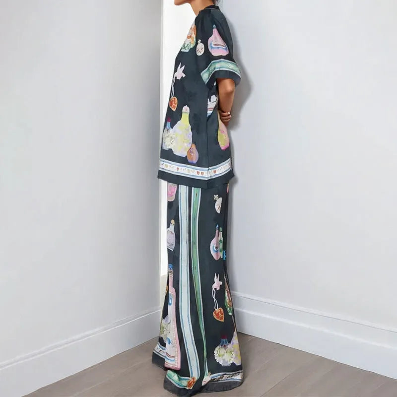 Women's black cartoon pattern holiday fashion set with trousers and cardigan-style top