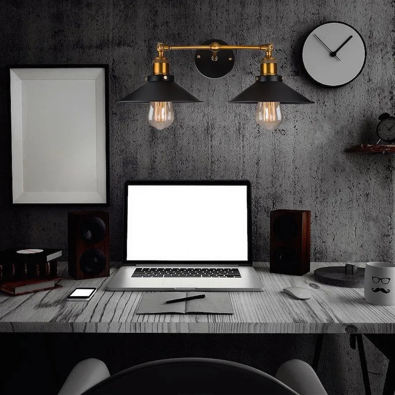 Black iron retro industrial style wall lamp with two adjustable light heads.