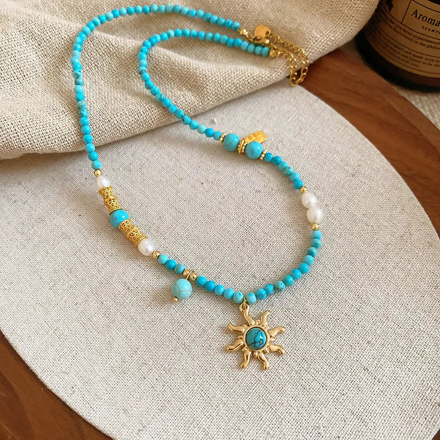 Freshwater pearl necklace with stone sun pendant on adjustable clavicle chain