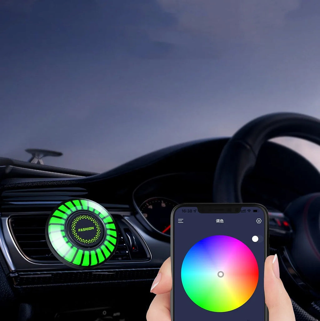 Car air vent aromatherapy diffuser with multicolour RGB lighting mounted in vehicle vent