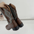 Brown women's mid-calf Martin boots with embroidered pattern and square low heel.