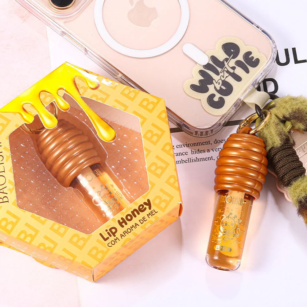 Honey lip gloss with keychain attachment for portable lip moisturising
