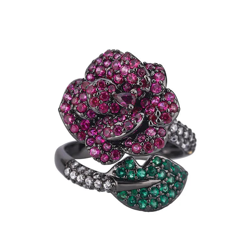 Women's black gold geometric ring with gold-plated red corundum flower detail