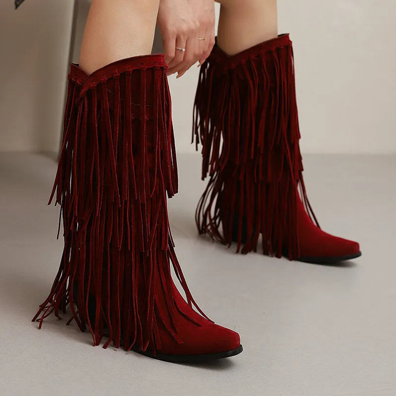 Women's brown suede knee-high boots with tassels, a chunky heel, and a waterproof platform sole.