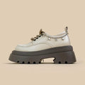 White platform leather Mary Jane shoes with round toe, lace-up front, and a thick 6-8cm chunky heel.