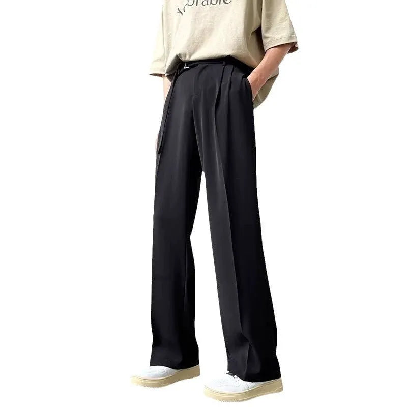 Black wide leg straight trousers with a loose fit on a hanger.