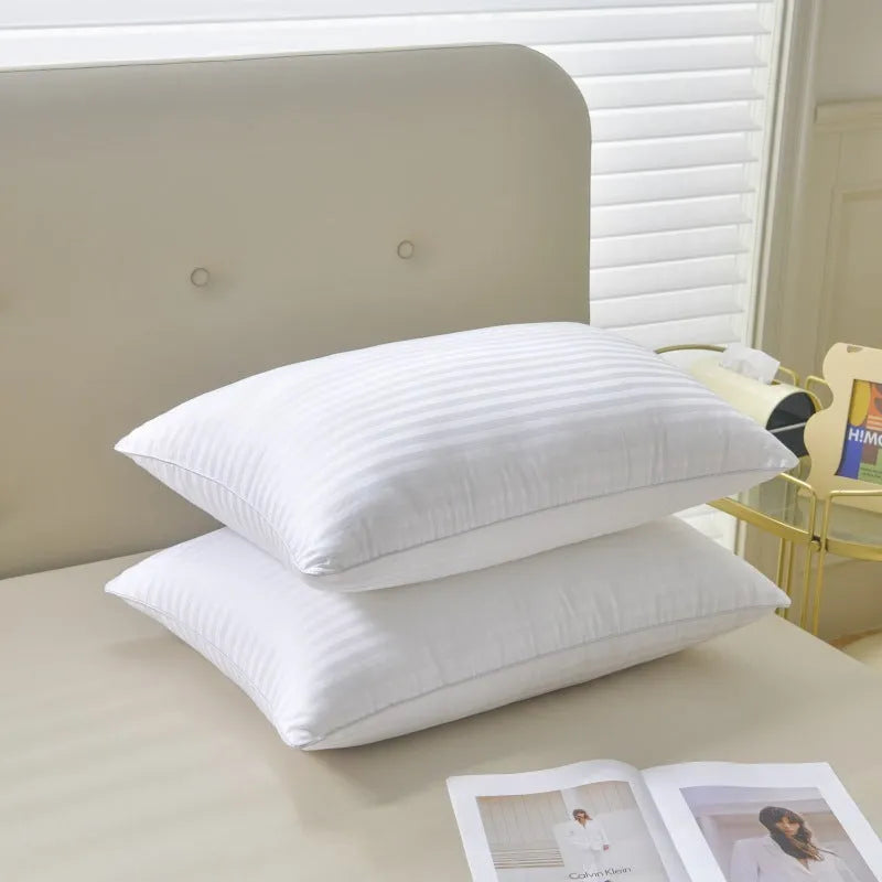 White satin stripe feather and cotton pillow shown in three different size options.