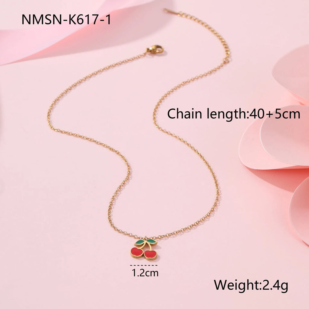 Four-piece cherry jewellery set with necklace, bracelet, earrings and ring in stainless steel with gold-toned finish