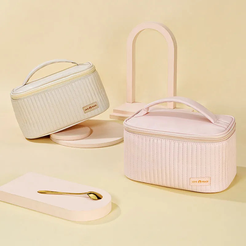 Open-top PU leather makeup bag in a choice of six solid colours including pink, beige and light blue.