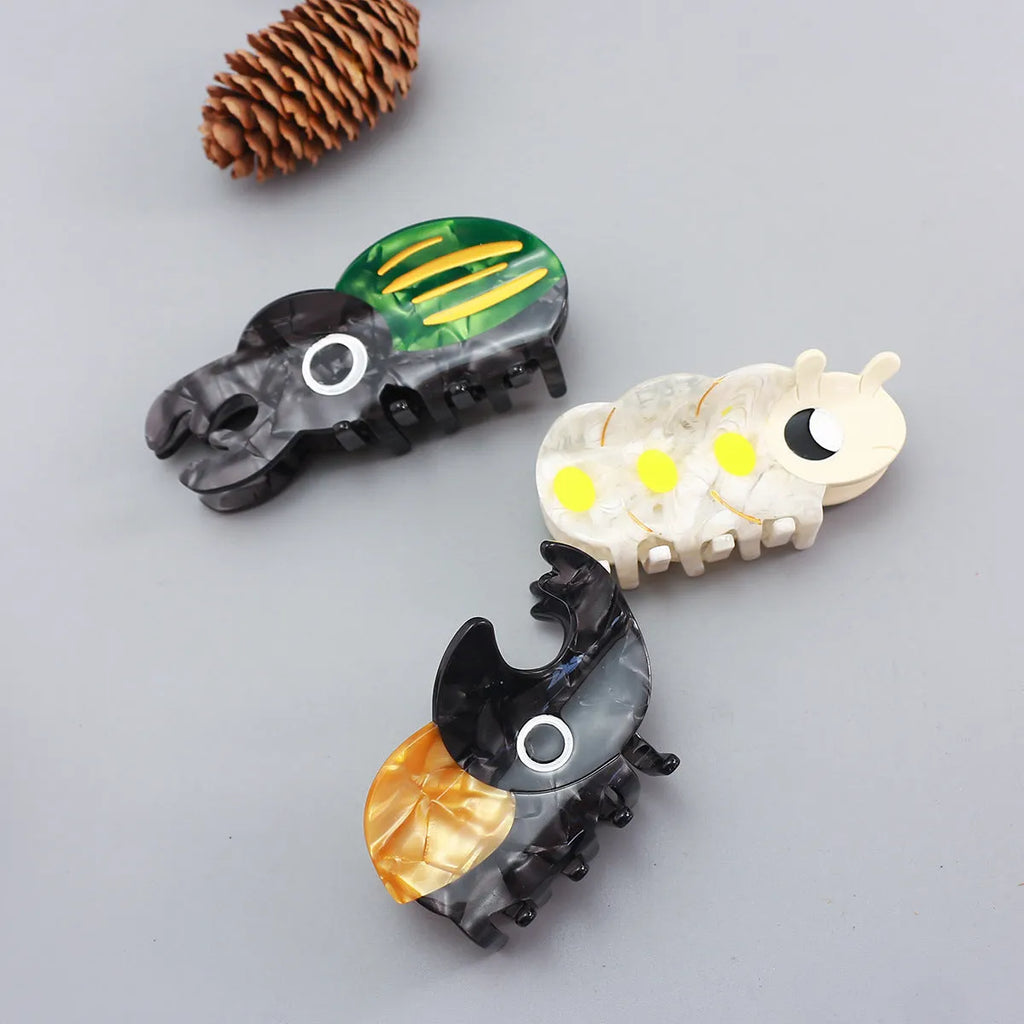 Handmade cellulose acetate Beetle Grip with cartoon caterpillar design in green or orange beetle colours