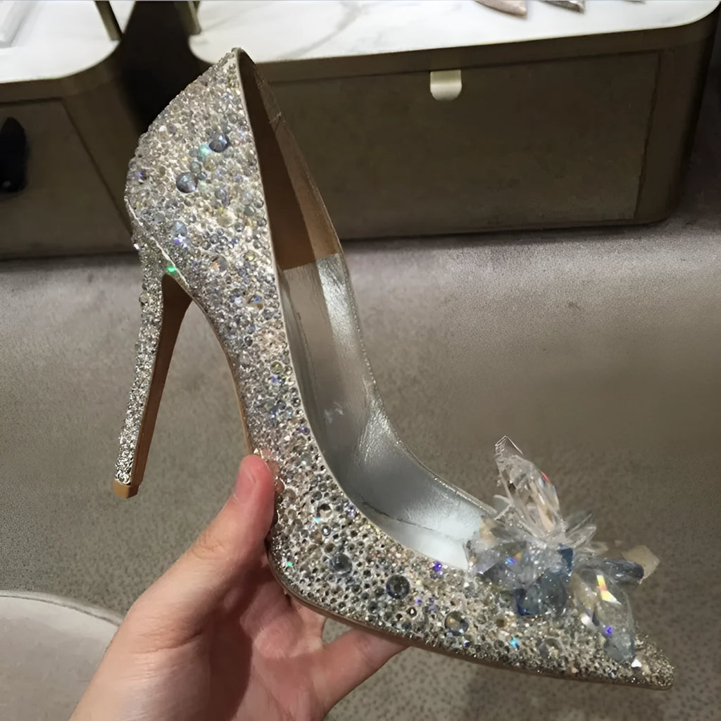 Women's gold pointed toe high heels with rhinestone details and stiletto heel