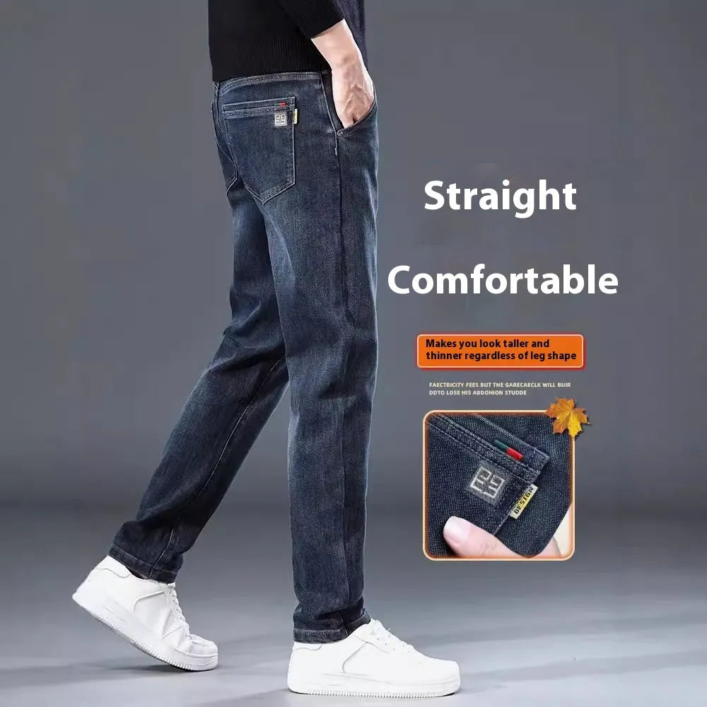 Man wearing blue grey slim straight casual trousers with a loose fit for summer street fashion.