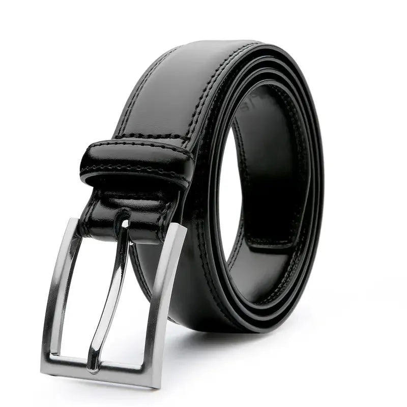 Men's brown leather belt with textured grain and metal buckle on a table.