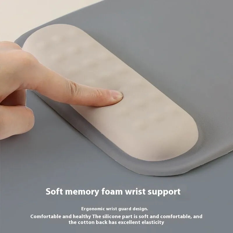 Ergonomic mouse pad with raised wrist support in cloth silicone material showing colour options