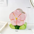 Ceramic flower pen holder storage box with floral design on desktop