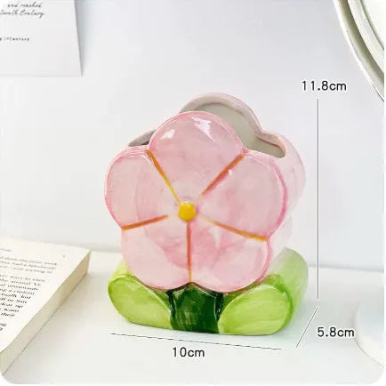 Ceramic flower pen holder storage box with floral design on desktop