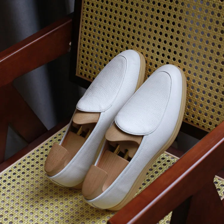 Men's handmade brown leather loafers with a low cut and textured TPR sole.