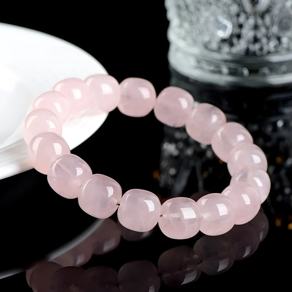 Natural bamboo crystal barrel bead bracelet with geometric pink beads measuring 11-12mm