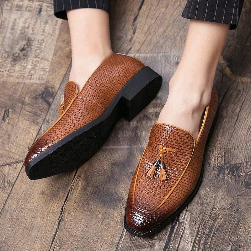 Men's black pointed slip-on shoe with a tassel on a business-style artificial PU upper.
