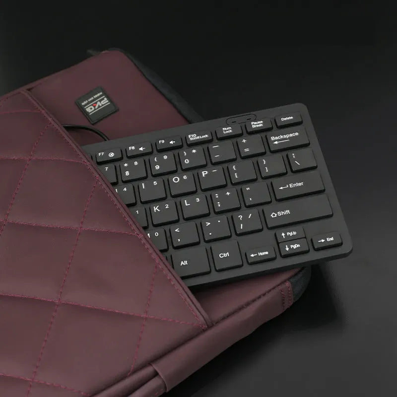 USB wired mini keyboard in black, white, pink or blue colours showing compact size