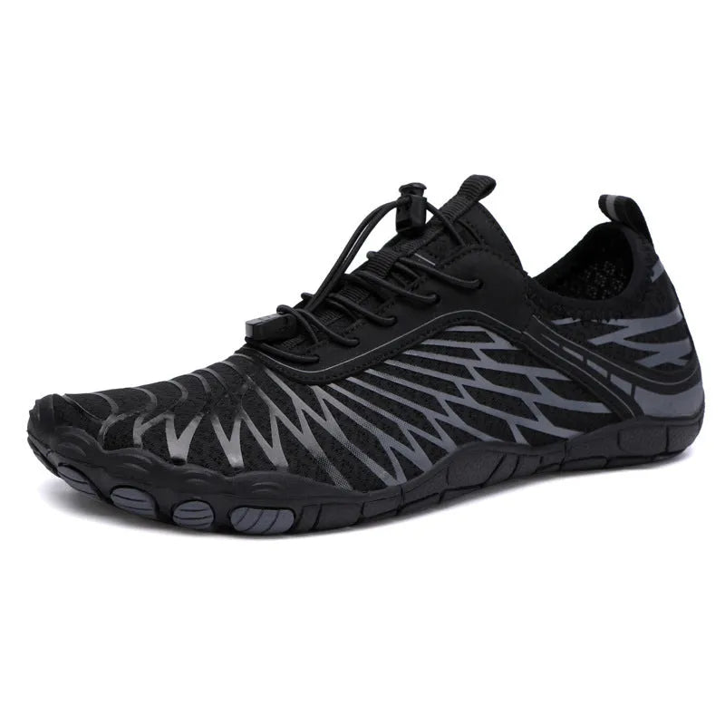 White and black lace-up casual trainers with rubber soles on a plain background