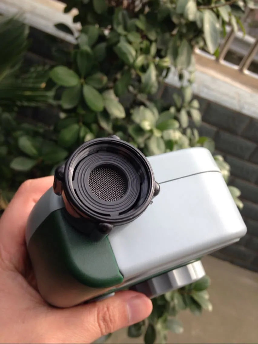 Green digital garden hose timer with copper connector and programmable watering display