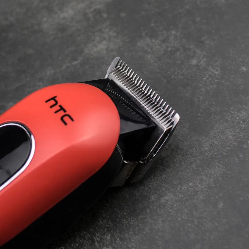 Professional digital electric hair clipper in black with brushless motor, waterproof body, and four limiting combs for pet and human grooming