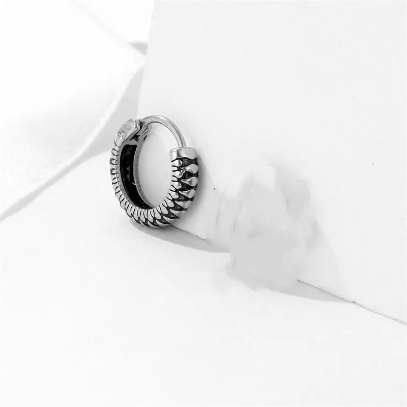 Silver geometric striped drop earrings with retro twist design and round sports-style elements