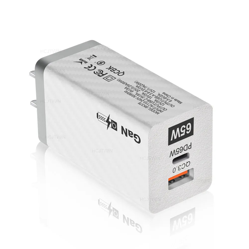 Gallium Nitride 65W laptop charger in black or white with compact dimensions and multiple electrical plug options