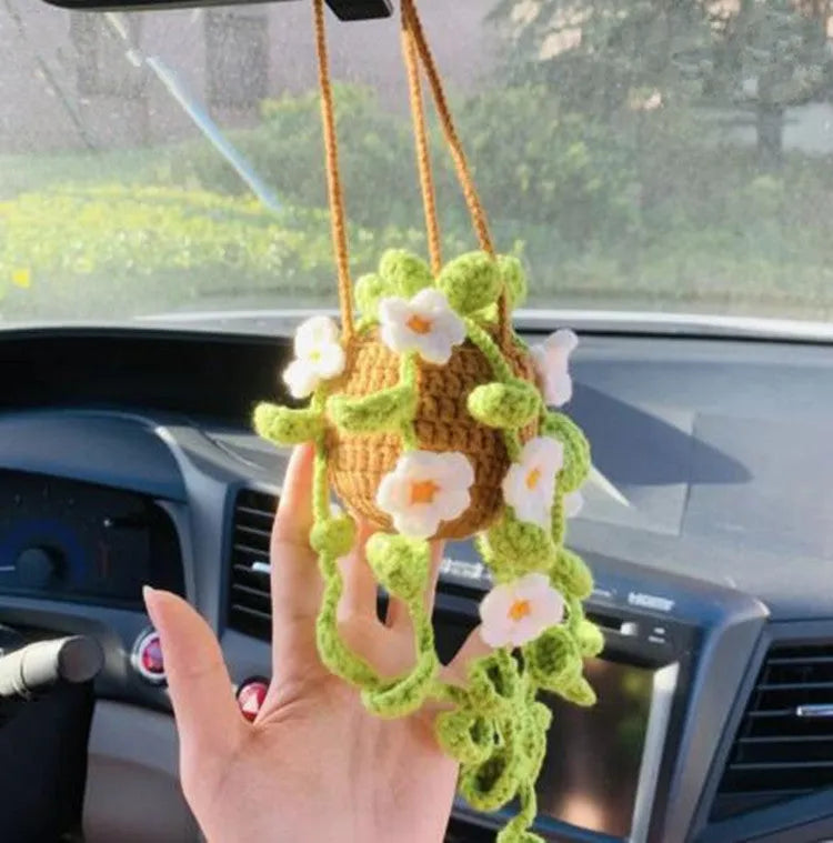 Knitted green and white car plant decoration with hanging rope