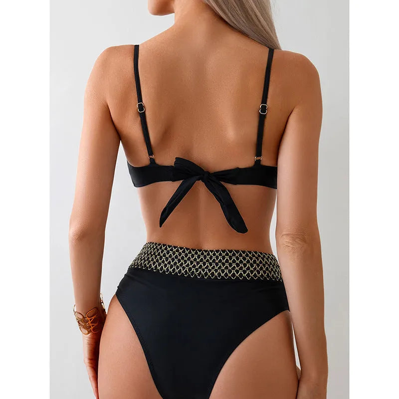 Black two-piece split bikini swimsuit on a mannequin, showing sleeveless top and briefs.