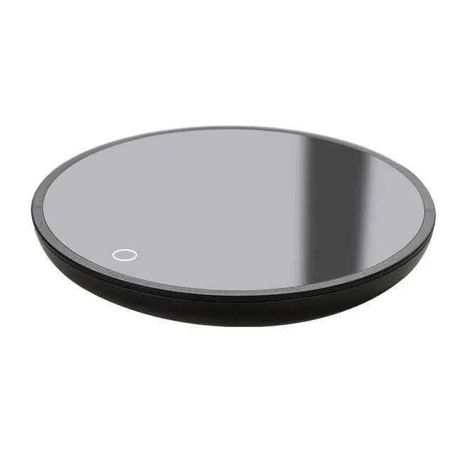 Black circular mug warmer with tempered glass surface and temperature switch