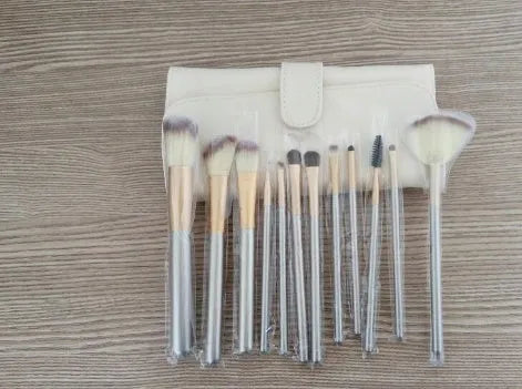Persian makeup brushes with rice white bristles and champagne handles in a set