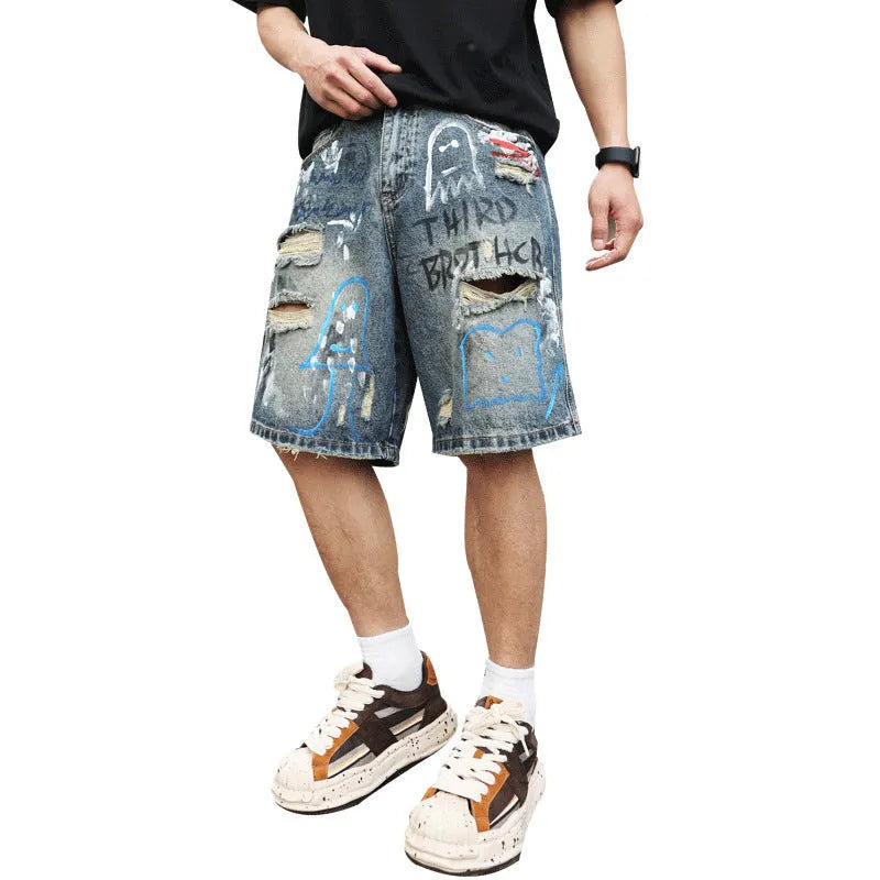 Blue ripped men's denim shorts with graffiti design and zipper fly