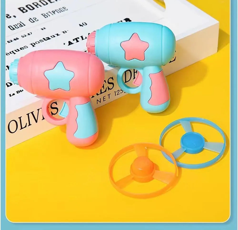 Blue plastic cat toy gun with frisbee launcher for indoor cats on white background