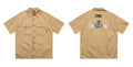 Men's loose fit half-sleeve pocket shirt in black, made from cotton blend fabric.