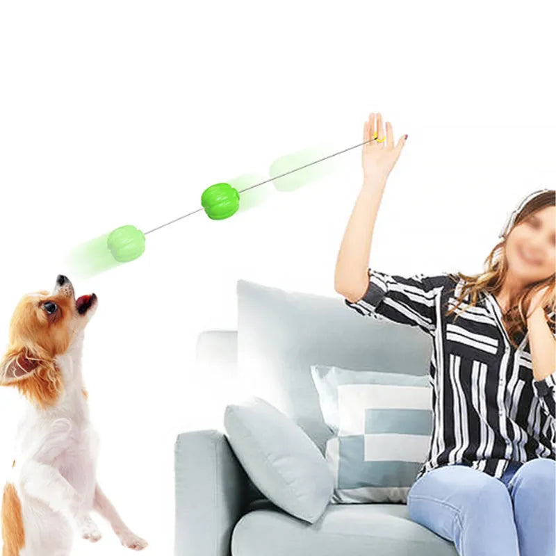 Orange pumpkin-shaped plastic dog chew ball with a squeaker for small dogs and teething puppies.