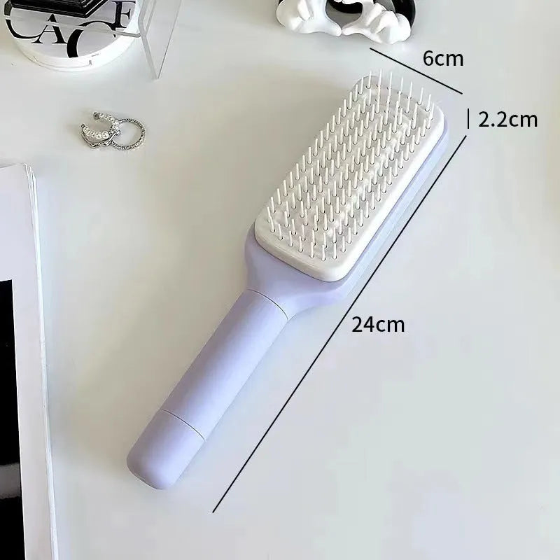 Roland purple self-cleaning hair brush with rotating handle and anti-static massage bristles.